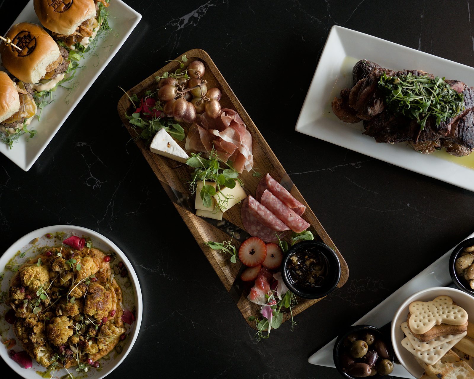 Charcuterie board with cured meats, cheese and fruit, restaurant menu photography South Florida